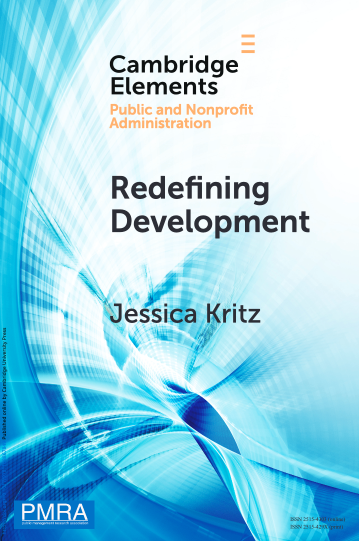 The cover of a book. The book is called "Redefining Development" and it is written by Jessica Kritz. The background is white and blue in a pattern that evokes both fluiditity and technology. It is more white in the top right hand corner and more blue in the bottom left hand corner. The title and author is written in black, as well as "Cambridge Elements", which has the orange text: "Public and Nonprofit Administration" beneath it. There is a blue, square logo in the bottom left hand corner, with white text that reads: PMRA.
